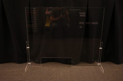 One of the portable protective barriers assembled by MadLab Technologies. The supplier sends the main piece cut to size, and the shop cuts the stabilizers and assembles them.