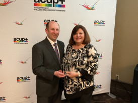 ACUP+ President Tom Lydon inducts June Lewis of Kellogg Community College into the ACUP+ Hall of Fame. 