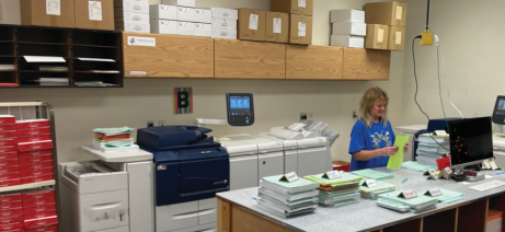 At Sheboygan Area School District Printing & Graphic Services, Vicki Crowns prepares a job order. The in-plant handles numerous small jobs from teachers across the district on its fleet of four Xerox D110s. Its Rochester Software Associates&rsquo; WebCRD system has proven invaluable in helping the shop process them all.