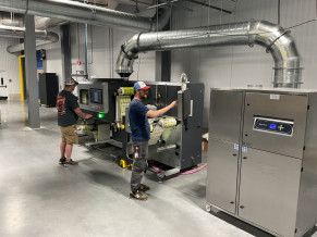 Operators cut labels on Sheetz' new Grafotronic DCL2-350 laser cutter.