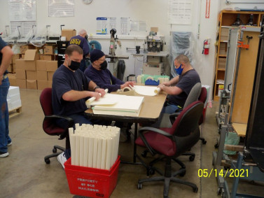 With plenty of manpower, the operation does a considerable amount of hand inserting.