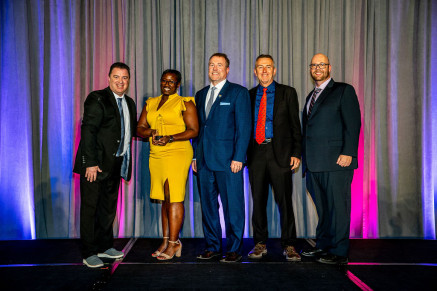 accepts the in-plant's Best of Division award at IPMA 2025.