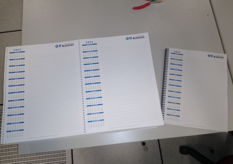 In-line coil punches on both new digital printers let the in-plant print and punch two-up sheets on 12x18" stock, which come out ready for cutting down to 8&frac12;x11".