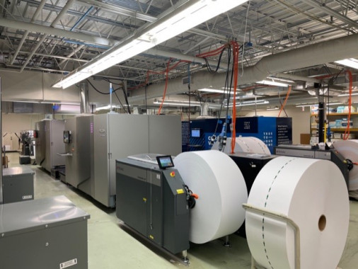 One of the Ricoh Pro VC40000 continuous-feed inkjet printers installed in Progressive&rsquo;s Cleveland facility, along with Tecnau roll-handling equipment.