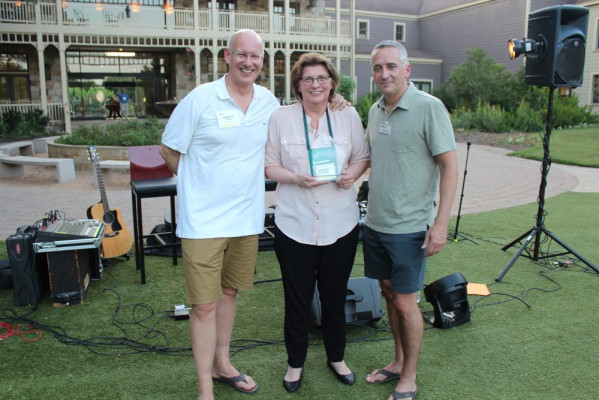 The Overall Contributing Attendee Award went to Cheryl Kahanec (center), CEO of Quantum Group. With her are Marco Boer (left) and David Pesko.