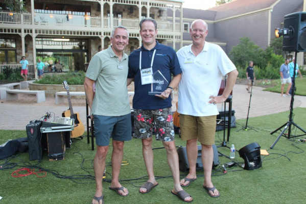 Accepting the award for the best case study for the publishing segment was Andy Fetherman (center) of Muller Martini. Awards were presented by David Pesko (left) and Marco Boer.