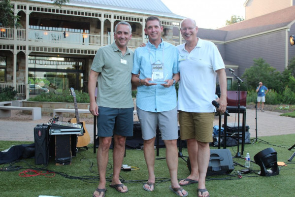 Accepting the award for the best case study for the general commercial segment was Mike Herald (center) of Ricoh. Awards were presented by David Pesko (left) and Marco Boer.