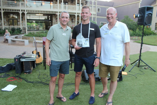 Accepting the &ldquo;Company to Watch Out For&rdquo; award was a very surprised Tyler Thompson (center) of Tilia Labs. Awards were presented by David Pesko (left) and Marco Boer.